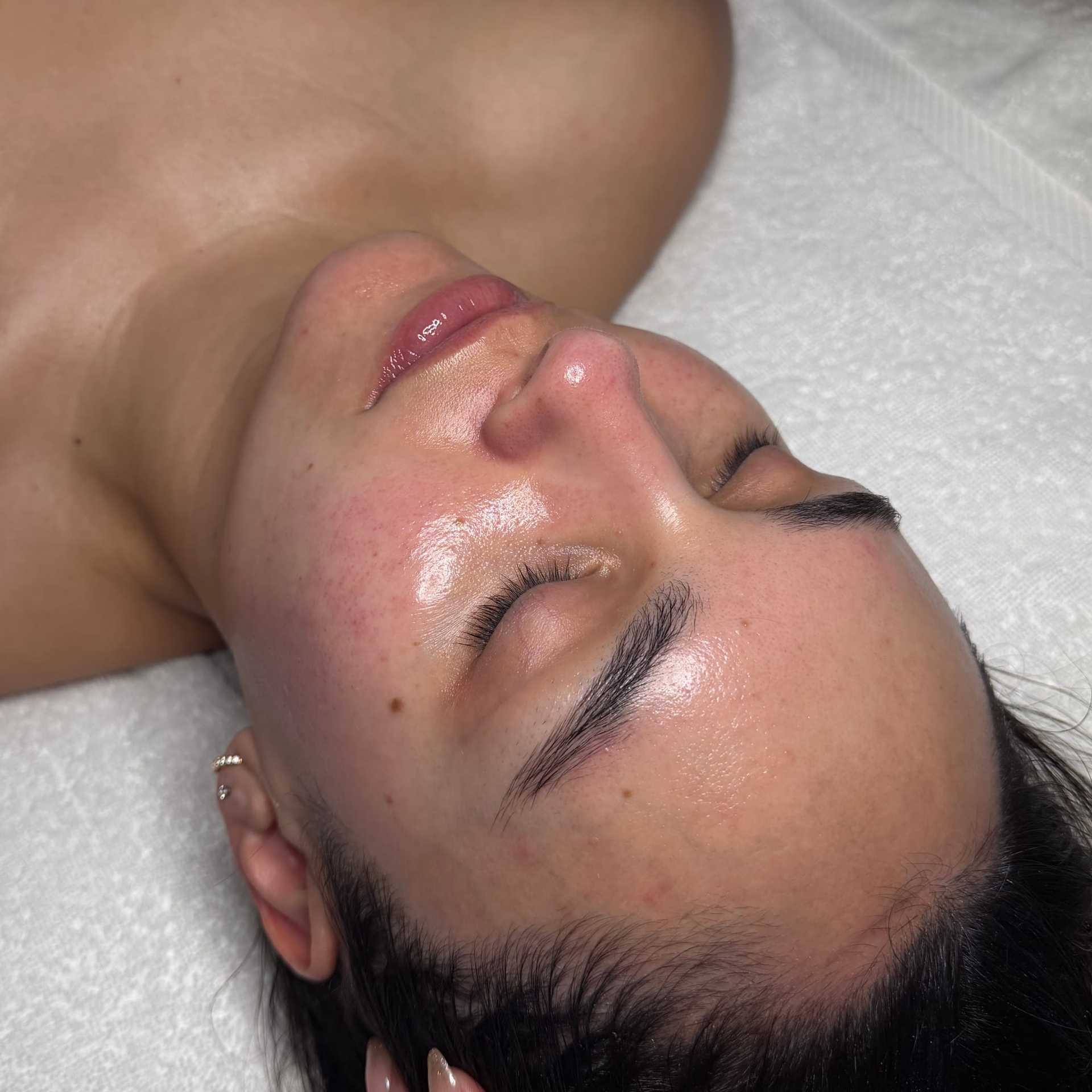 Spa treatment on woman's face with glowing, hydrated skin.